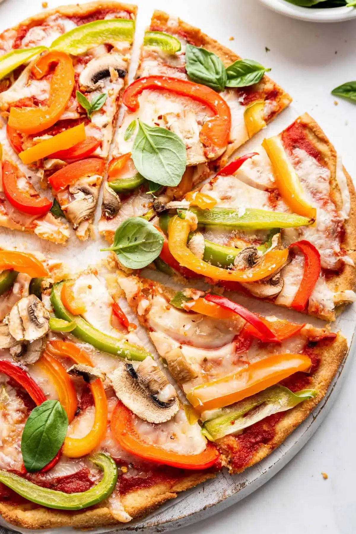 Delicious homemade almond flour pizza topped with fresh ingredients