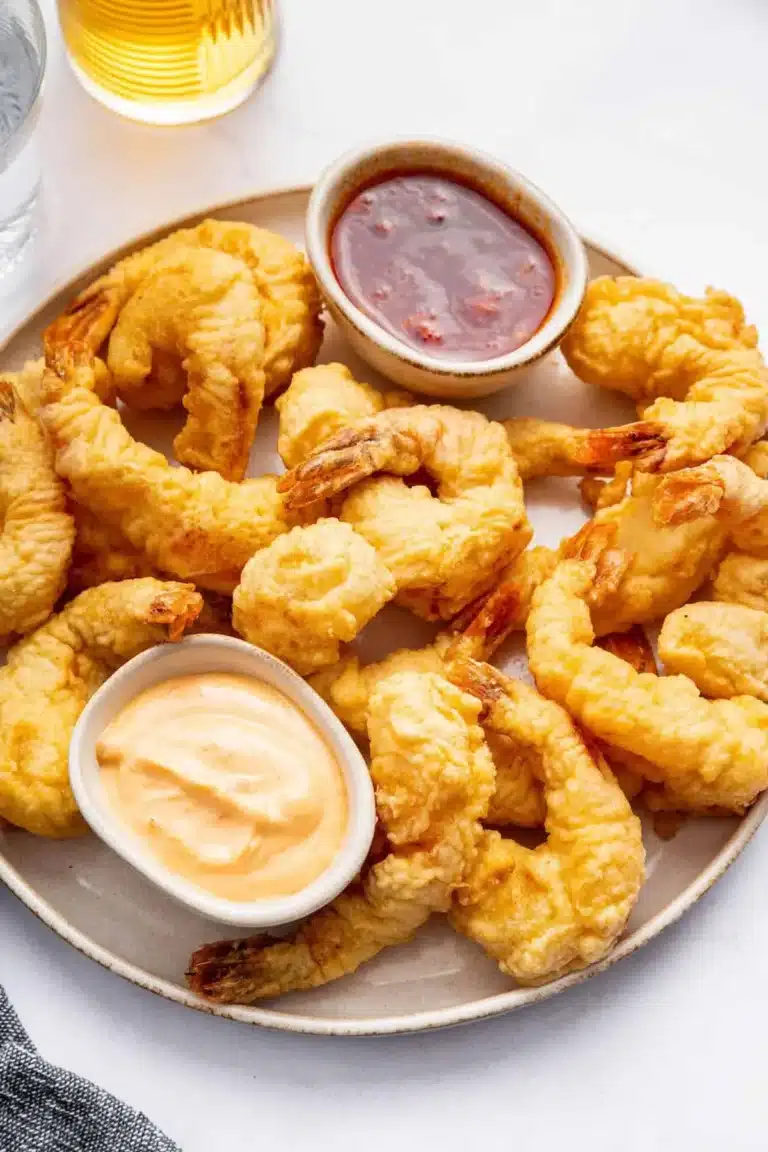 Plate of crispy shrimp tempura served with dipping sauce