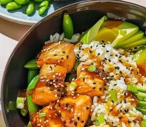 Honey Butter Roasted Salmon Rice Bowl garnished with vegetables and rice