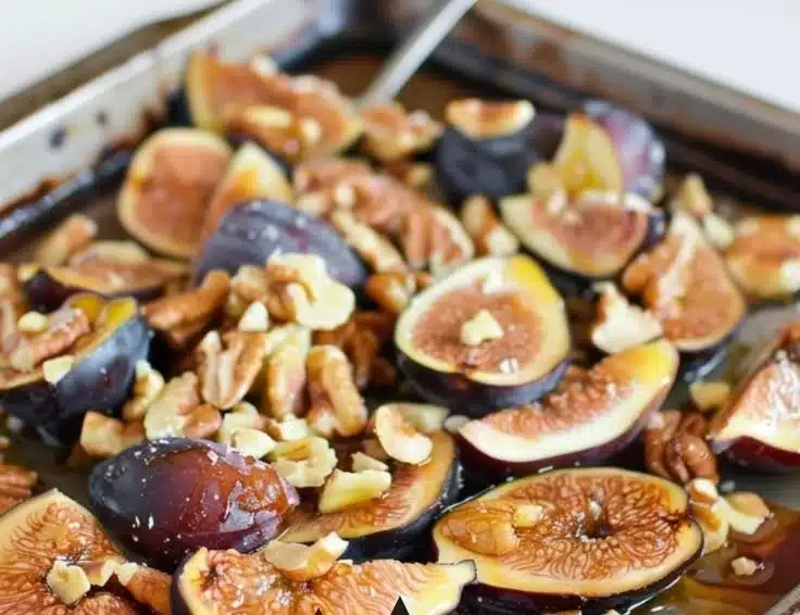 Honey-roasted walnuts with figs in a rustic bowl, showcasing a delicious snack.