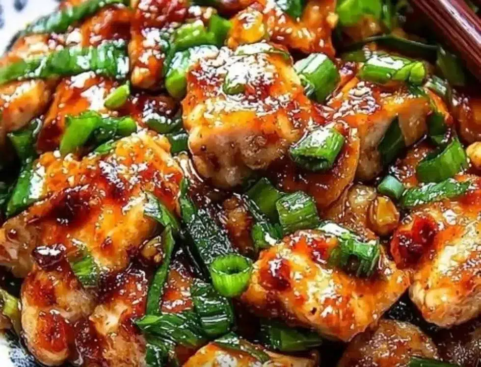 Delicious Chinese Scallion Chicken dish garnished with fresh scallions.
