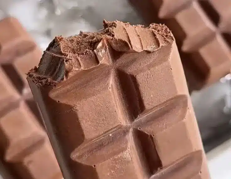 Bowl of homemade chocolate ice cream topped with chocolate shavings