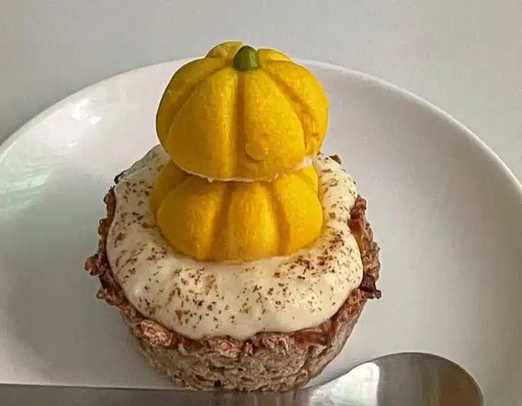 Delicious Pumpkin Oat Tart garnished with spices and nuts, perfect for fall harvest.